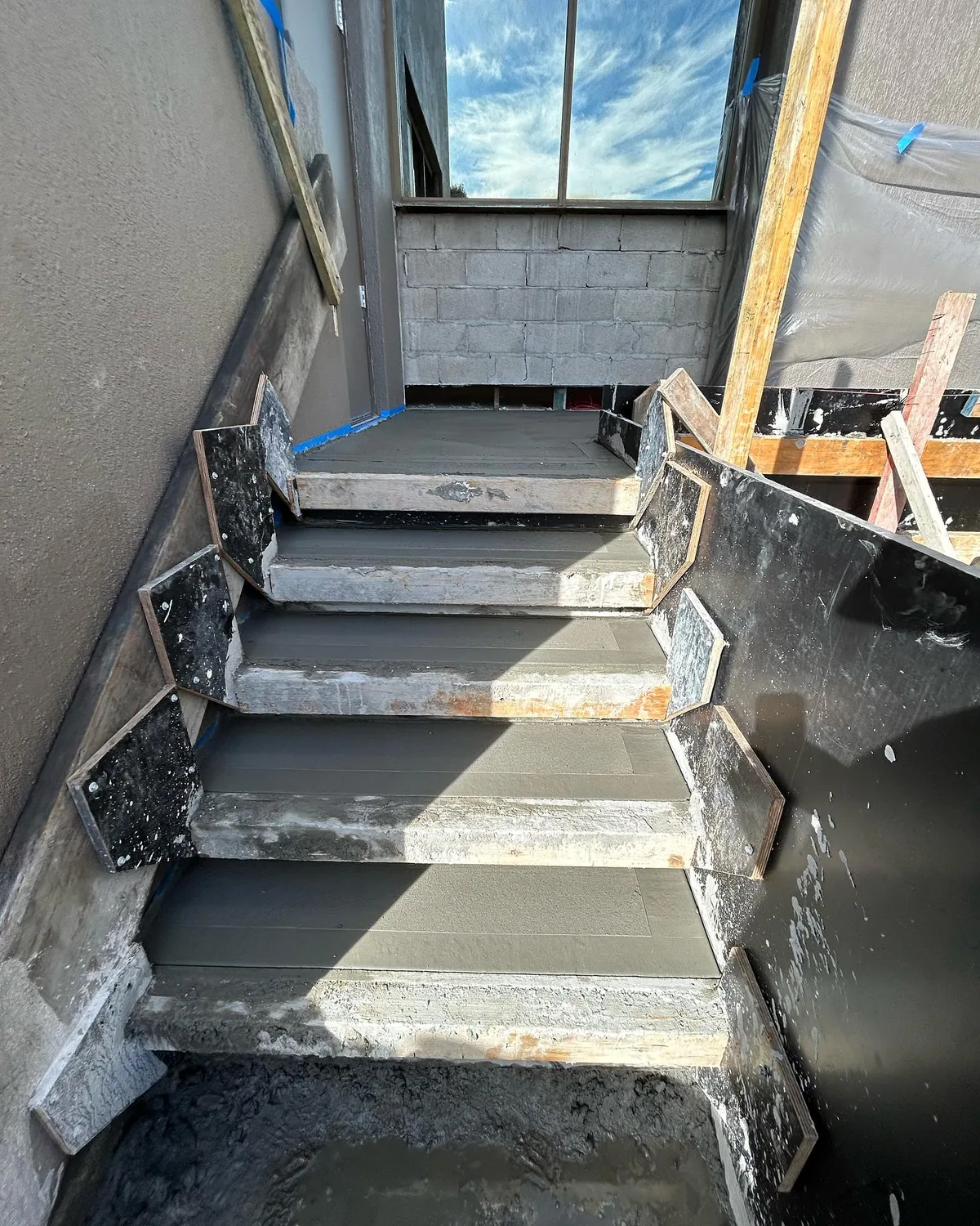 Narrow charcoal stairs side access