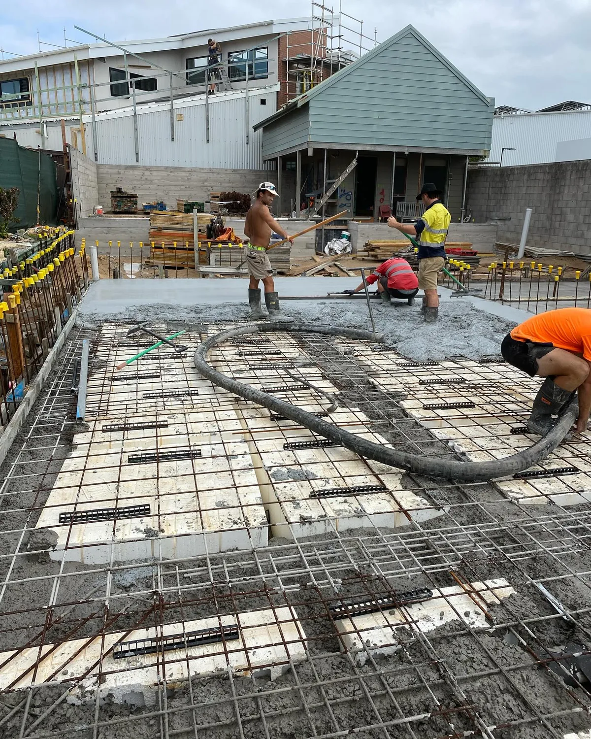 Merit Concreting crew pouring a residential slab in Newcastle