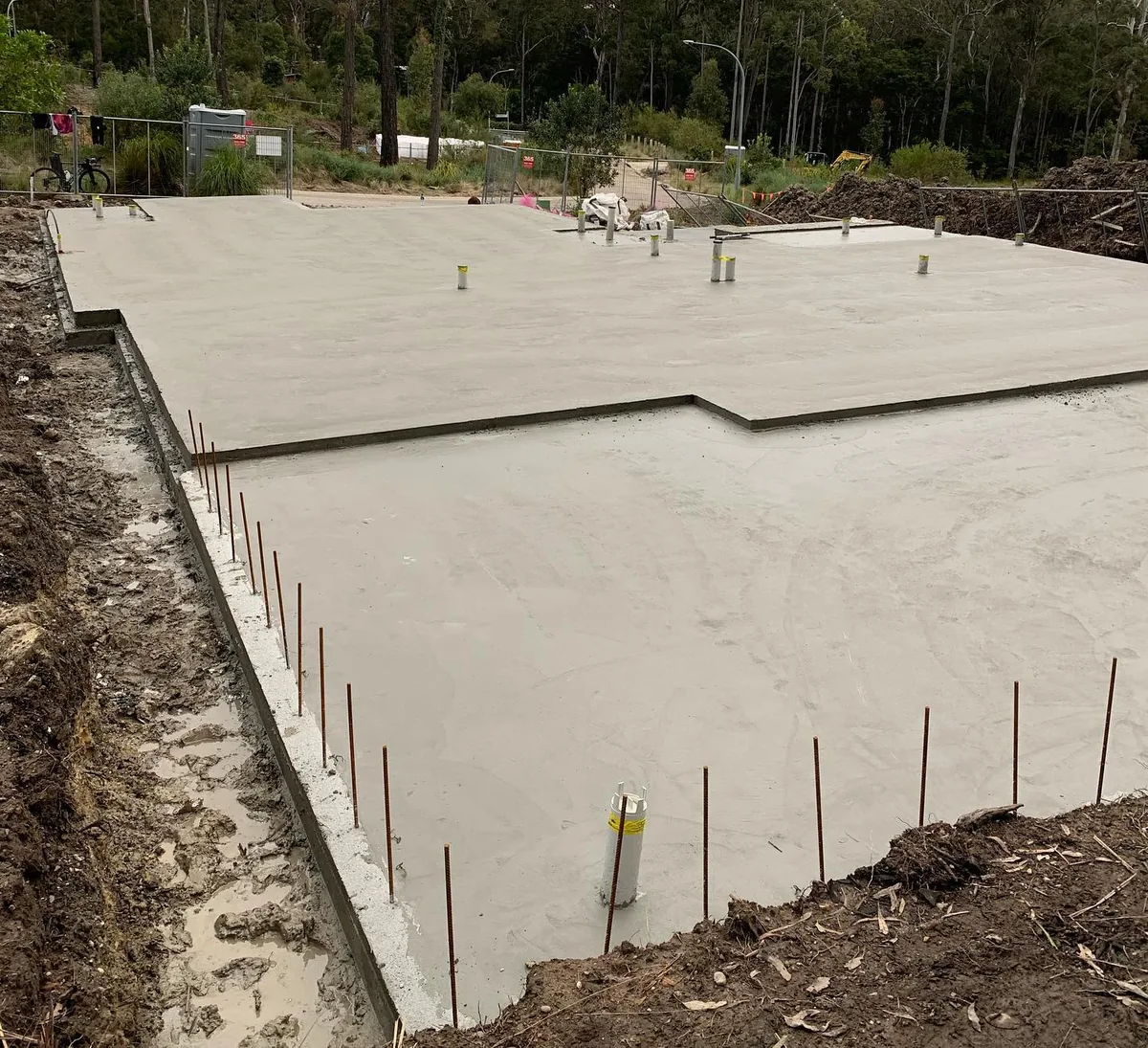 Stepped house slab with rebar starter bars